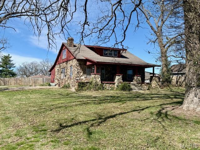 1681 S US Highway 63, West Plains, MO 65775 - back of property featuring a chimney, a porch, and stone siding