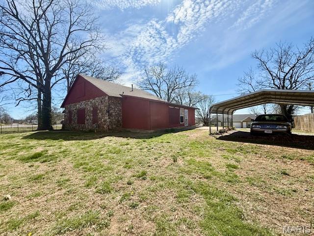 1681 S US Highway 63, West Plains, MO 65775 - view of side of property featuring a detached carport and stone siding
