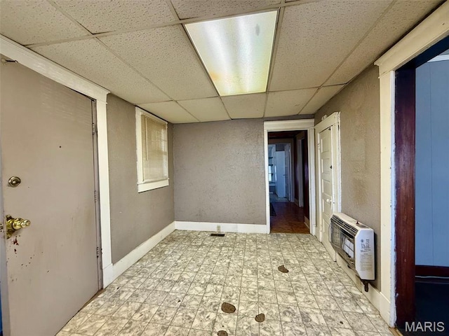 1681 S US Highway 63, West Plains, MO 65775 - spare room with a paneled ceiling, heating unit, baseboards, light floors, and a textured wall