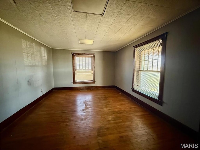 1681 S US Highway 63, West Plains, MO 65775 - spare room featuring crown molding, hardwood / wood-style flooring, and baseboards