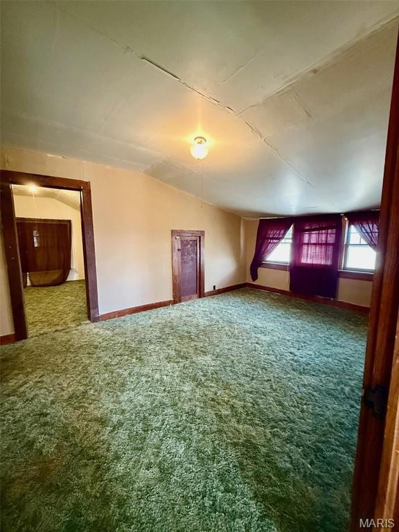 1681 S US Highway 63, West Plains, MO 65775 - spare room with carpet floors, vaulted ceiling, and baseboards
