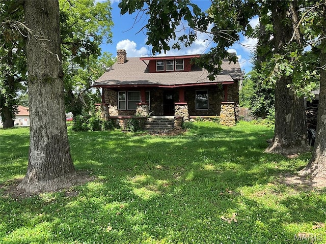 1681 S US Highway 63, West Plains, MO 65775 - view of front of home featuring stone siding, a chimney, a front lawn, a porch, and a shingled roof