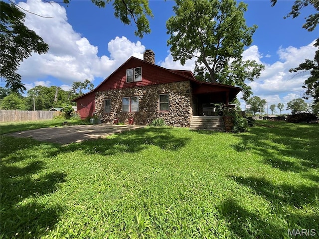 1681 S US Highway 63, West Plains, MO 65775 - view of home's exterior featuring stone siding and a chimney