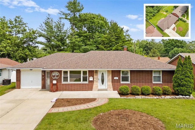 304 S Augusta St, Ofallon, IL 62269 - single story home with a shingled roof, brick siding, a garage, a front lawn, and concrete driveway