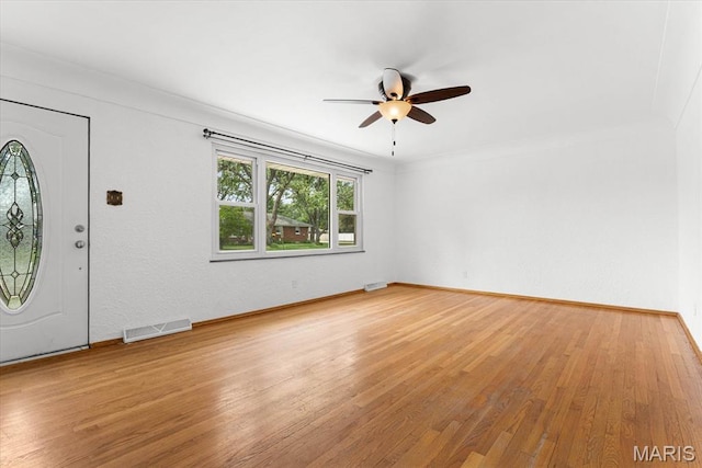 304 S Augusta St, Ofallon, IL 62269 - foyer entrance with ceiling fan, light wood-style floors, and baseboards