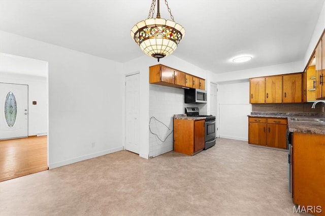 304 S Augusta St, Ofallon, IL 62269 - kitchen with appliances with stainless steel finishes, brown cabinetry, and a sink
