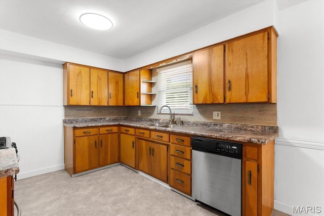 304 S Augusta St, Ofallon, IL 62269 - kitchen featuring stainless steel dishwasher, a sink, brown cabinets, light carpet, and decorative backsplash