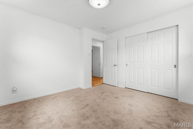 304 S Augusta St, Ofallon, IL 62269 - unfurnished bedroom with carpet, baseboards, and a closet