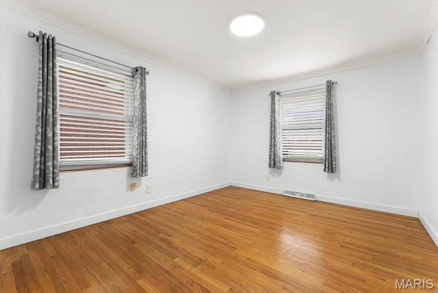 304 S Augusta St, Ofallon, IL 62269 - empty room featuring crown molding, baseboards, and wood finished floors