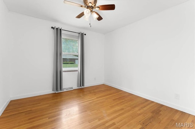 304 S Augusta St, Ofallon, IL 62269 - spare room with light wood finished floors, a ceiling fan, and baseboards