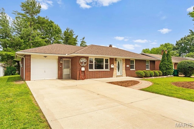 304 S Augusta St, Ofallon, IL 62269 - ranch-style house featuring a garage, concrete driveway, brick siding, a front lawn, and a chimney