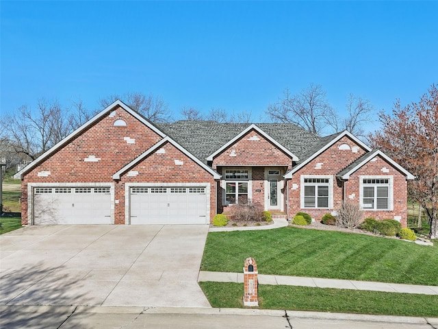 2707 Fairway Estates Dr, Wentzville, MO 63385 - view of front of house with a front yard, driveway, a garage, and brick siding
