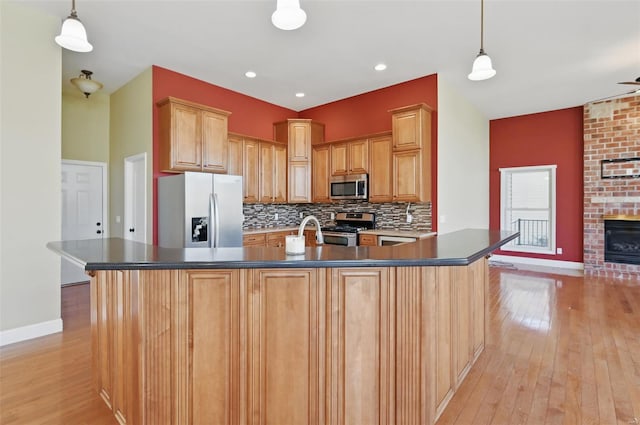 2707 Fairway Estates Dr, Wentzville, MO 63385 - kitchen featuring stainless steel appliances, light wood-style flooring, baseboards, and recessed lighting