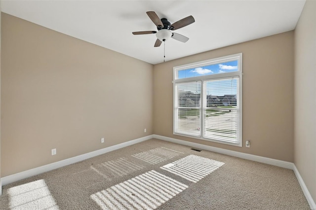 2707 Fairway Estates Dr, Wentzville, MO 63385 - spare room featuring light carpet, baseboards, and ceiling fan