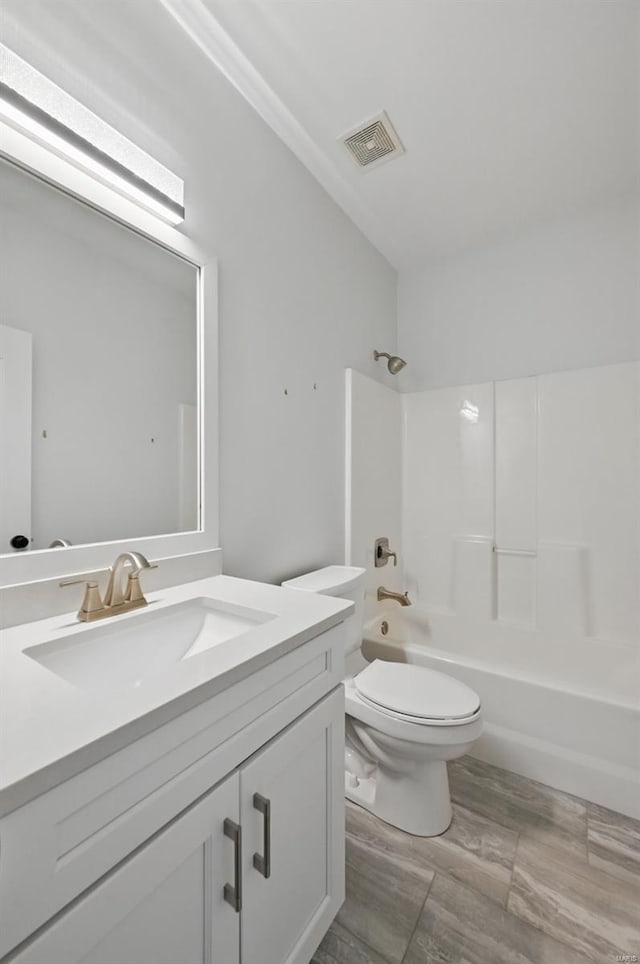 2707 Fairway Estates Dr, Wentzville, MO 63385 - bathroom with toilet, tub / shower combination, vanity, and wood finished floors