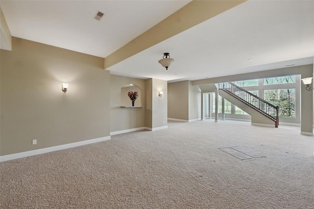 2707 Fairway Estates Dr, Wentzville, MO 63385 - unfurnished living room with carpet, baseboards, and stairway