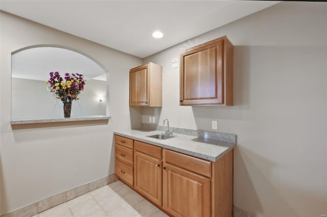 2707 Fairway Estates Dr, Wentzville, MO 63385 - kitchen featuring a sink, light countertops, baseboards, light tile patterned floors, and recessed lighting