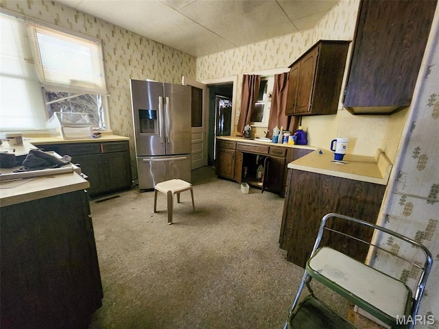 760 Swanwick St, Chester, IL 62233 - kitchen featuring wallpapered walls, stainless steel refrigerator with ice dispenser, light carpet, dark brown cabinets, and light countertops