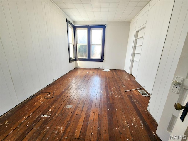 760 Swanwick St, Chester, IL 62233 - unfurnished room featuring wood-type flooring, built in features, and wood walls