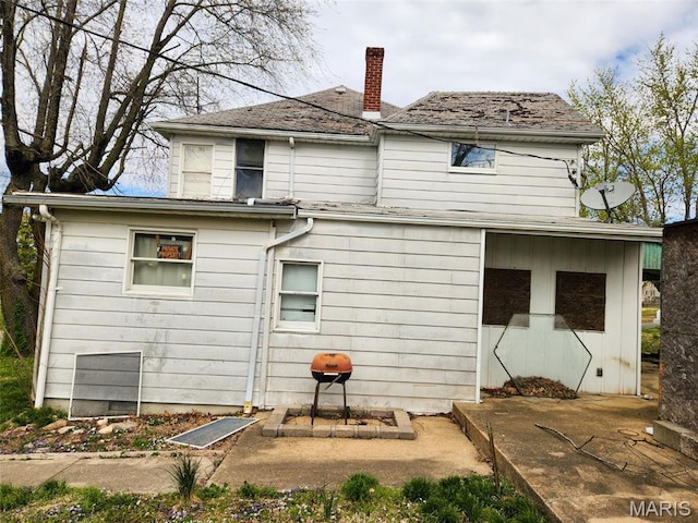 760 Swanwick St, Chester, IL 62233 - rear view of house featuring a chimney