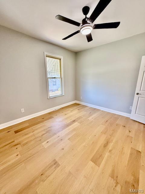 201 W Barr Ave, Jerseyville, IL 62052 - unfurnished room with a ceiling fan, baseboards, and light wood finished floors