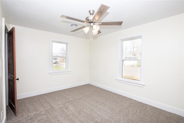 106 N A St, Cuba, MO 65453 - carpeted spare room featuring healthy amount of natural light, ceiling fan, and baseboards