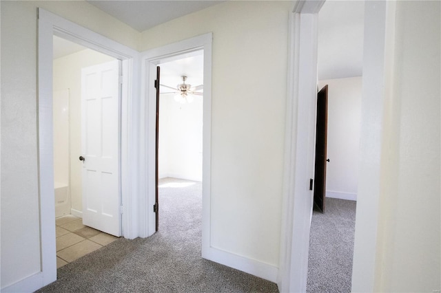 106 N A St, Cuba, MO 65453 - hallway featuring carpet floors and tile patterned floors