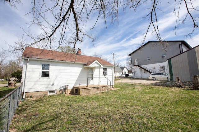 106 N A St, Cuba, MO 65453 - rear view of house with a chimney