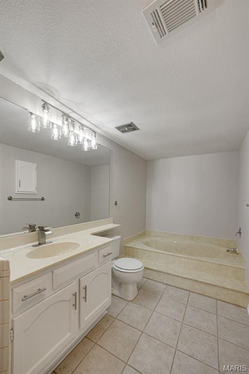 1420 Heritage Lndg Unit 207, Saint Charles, MO 63303 - bathroom featuring vanity, a bath, tile patterned floors, toilet, and a textured ceiling