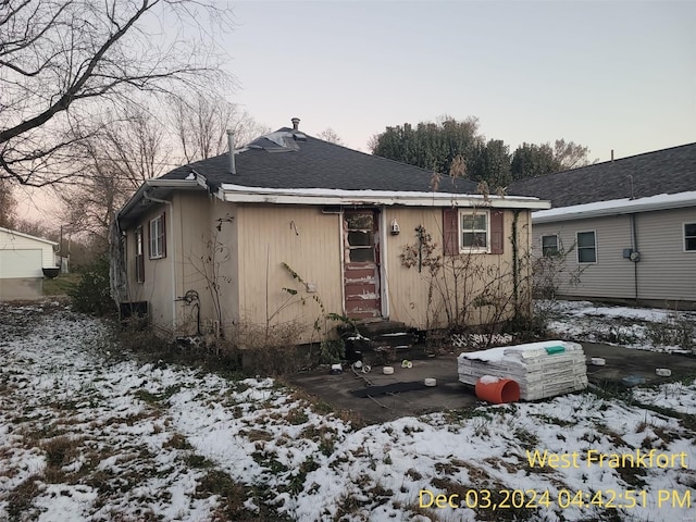 310 S Odle, West Frankfort, IL 62896 - snow covered property featuring entry steps and a shingled roof