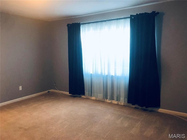 6990 Colonial Woods Dr Unit 59, Saint Louis, MO 63129 - spare room featuring carpet and baseboards