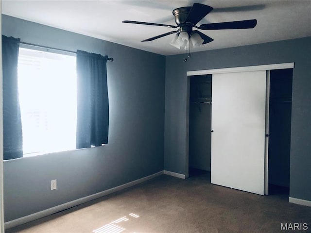 6990 Colonial Woods Dr Unit 59, Saint Louis, MO 63129 - unfurnished bedroom featuring a closet, carpet flooring, baseboards, and a ceiling fan