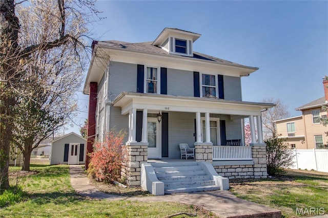 502 N State St, Jerseyville, IL 62052 - american foursquare style home featuring covered porch and fence