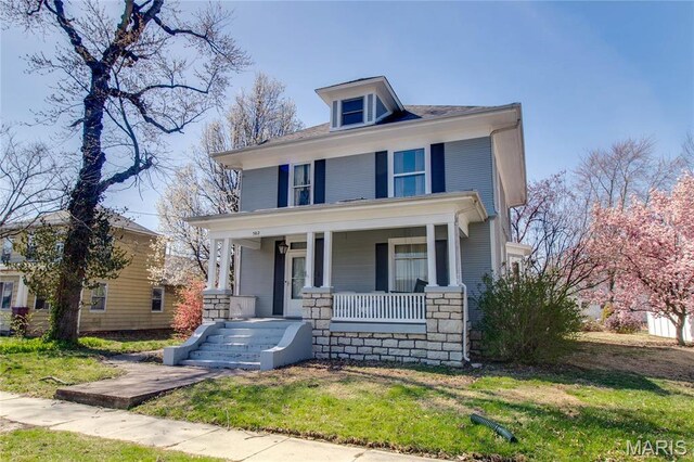 502 N State St, Jerseyville, IL 62052 - traditional style home with a porch and a front yard