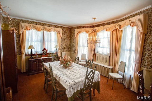 502 N State St, Jerseyville, IL 62052 - dining space featuring wallpapered walls, a chandelier, dark colored carpet, ornamental molding, and radiator