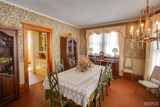 502 N State St, Jerseyville, IL 62052 - carpeted dining space with wallpapered walls, a chandelier, and ornamental molding