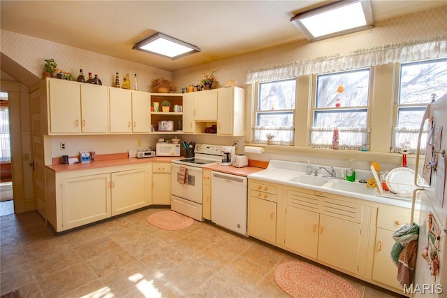 502 N State St, Jerseyville, IL 62052 - kitchen with white appliances, open shelves, wallpapered walls, light countertops, and a sink