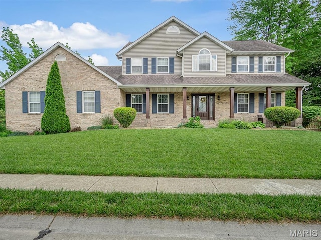 157 Knob Creek Ln, Ofallon, IL 62269 - view of front facade featuring brick siding, a front yard, and a porch