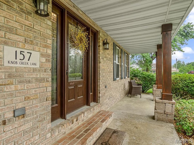 157 Knob Creek Ln, Ofallon, IL 62269 - entrance to property with a porch and brick siding
