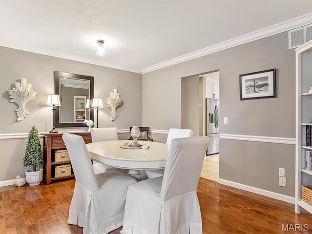 157 Knob Creek Ln, Ofallon, IL 62269 - dining room with ornamental molding and light wood finished floors