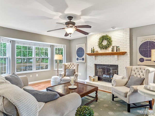 157 Knob Creek Ln, Ofallon, IL 62269 - living room with a ceiling fan, wood finished floors, and a brick fireplace