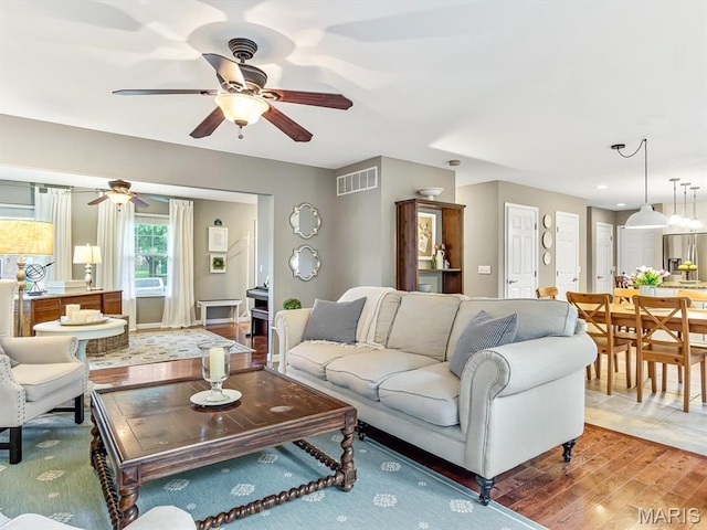 157 Knob Creek Ln, Ofallon, IL 62269 - living area with ceiling fan and wood finished floors