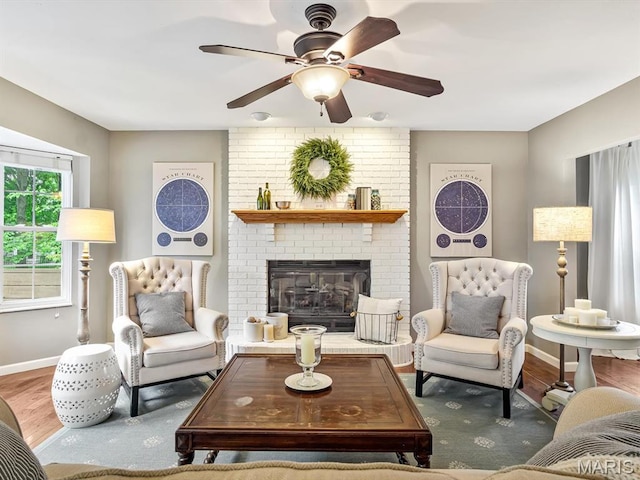 157 Knob Creek Ln, Ofallon, IL 62269 - living area featuring wood finished floors, ceiling fan, and a fireplace