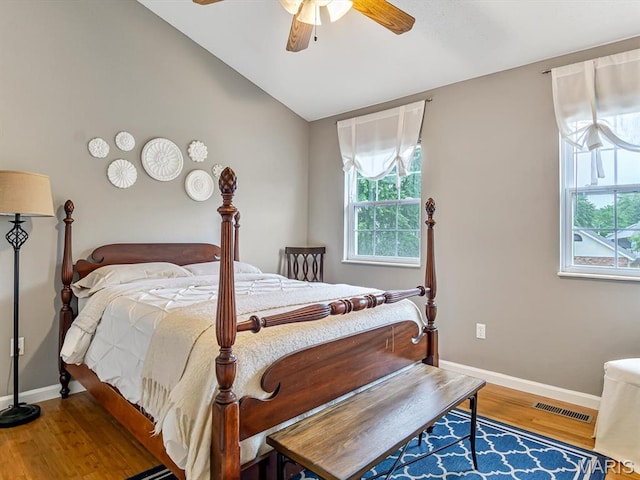 157 Knob Creek Ln, Ofallon, IL 62269 - bedroom featuring multiple windows, vaulted ceiling, wood finished floors, and a ceiling fan