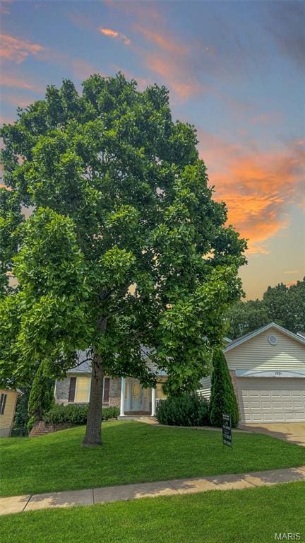 1051 Autumn Oaks Dr, Imperial, MO 63052 - view of front facade featuring a lawn, a garage, and concrete driveway
