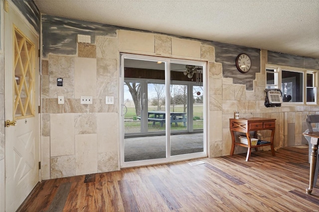 23425 N Everett Carr Rd, Mo, MO 65243 - entryway with a textured ceiling, wood finished floors, and tile walls