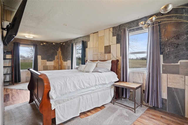23425 N Everett Carr Rd, Mo, MO 65243 - bedroom featuring a textured ceiling and wood finished floors
