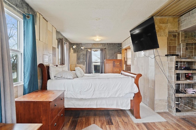 23425 N Everett Carr Rd, Mo, MO 65243 - bedroom with a textured ceiling and wood finished floors