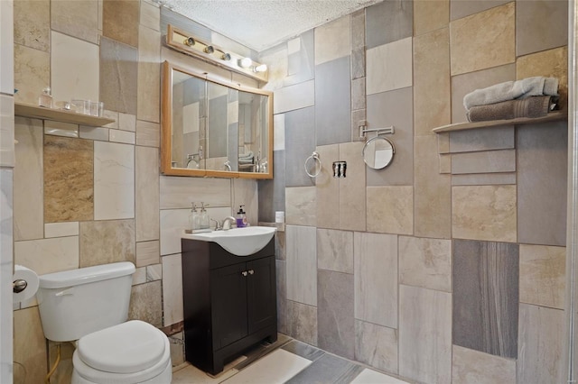 23425 N Everett Carr Rd, Mo, MO 65243 - bathroom featuring tile walls, toilet, a textured ceiling, and vanity