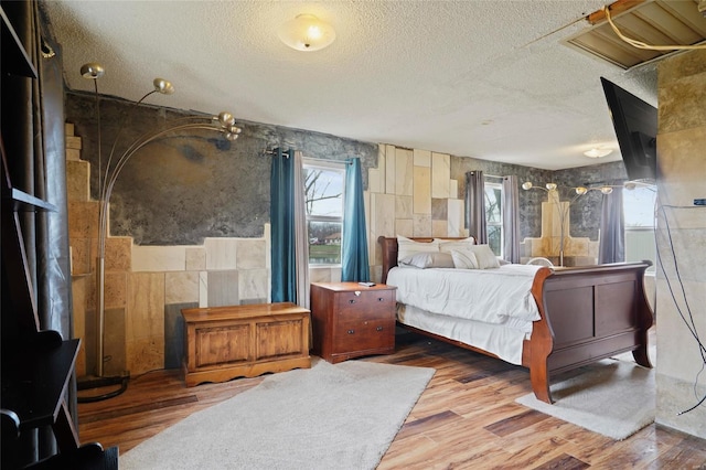 23425 N Everett Carr Rd, Mo, MO 65243 - bedroom with a textured ceiling and wood finished floors